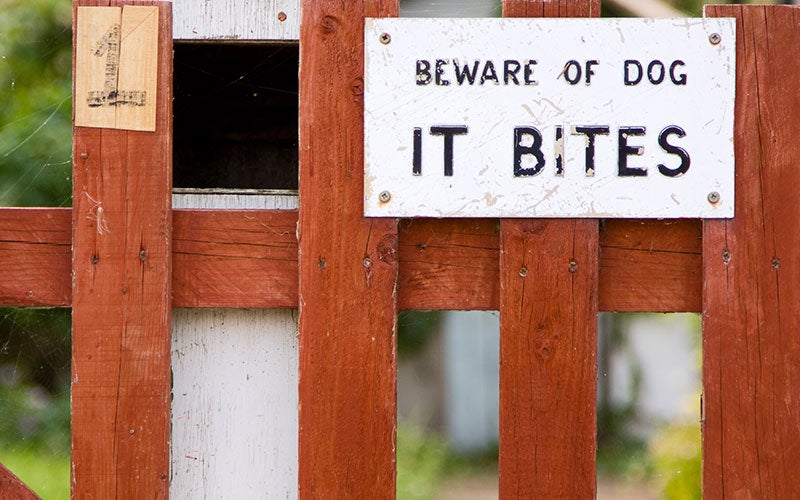 beware of dog sign Johnson Livingston Attorneys in Orem UT